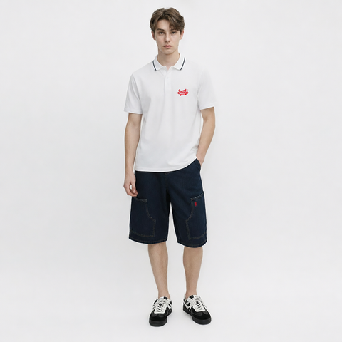 A male model is wearing shorts paired with the Smith's 1906 MPO01 White Polo.