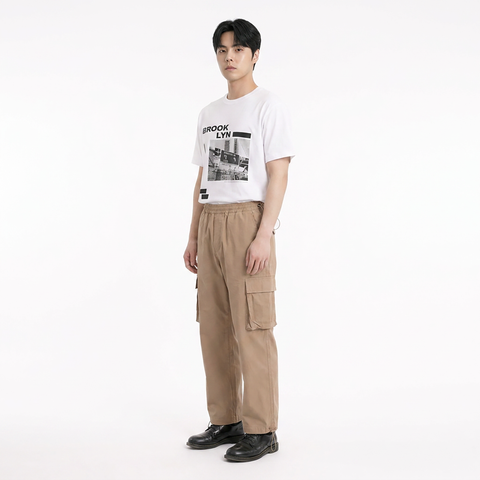 A male model is wearing a T-shirt paired with the Smith's 1906 MPT02 Khaki Pants.