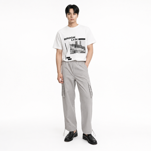 A male model is wearing a T-shirt paired with the Smith's 1906 MPT02 Light Grey Pants.