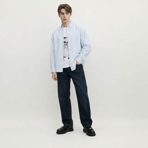 A male model is wearing jeans paired with the Smith's 1906 MSR02 Light Blue Shirt.