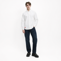 A male model is wearing jeans paired with the Smith's 1906 MSR02 White Shirt.
