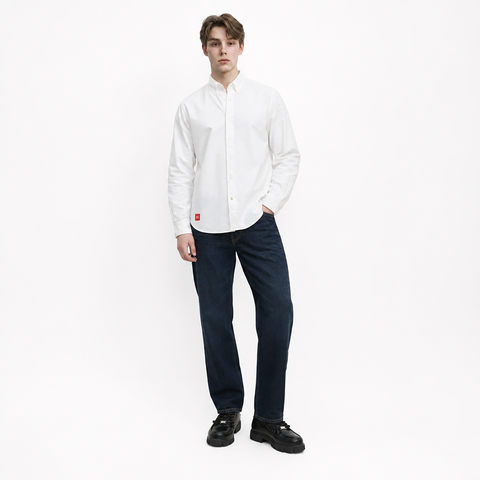 A male model is wearing jeans paired with the Smith's 1906 MSR02 White Shirt.