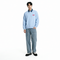 A male model is wearing jeans paired with the Smith's 1906 MSW02 Light Blue Sweatshirt.