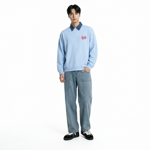 A male model is wearing jeans paired with the Smith's 1906 MSW02 Light Blue Sweatshirt.