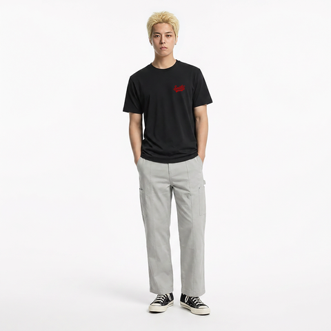 A male model is wearing a pair of pants paired with the Smith's 1906 MTE01 Black T-Shirt.
