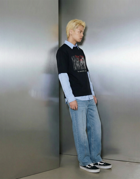 A male model from Smith's 1906 leans slightly against the wall.