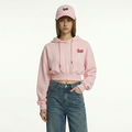 A female model is wearing a hoodie paired with the Smith's 1906 UCP02 Pink Cap.