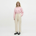 A female model is wearing a hoodie paired with the Smith's 1906 WPT01 Beige Pants.