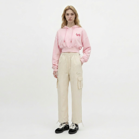 A female model is wearing a hoodie paired with the Smith's 1906 WPT01 Beige Pants.