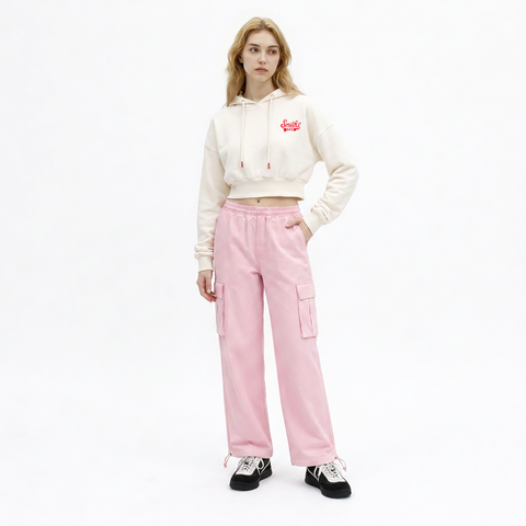 A female model is wearing a hoodie paired with the Smith's 1906 WPT01 Pink Pants.