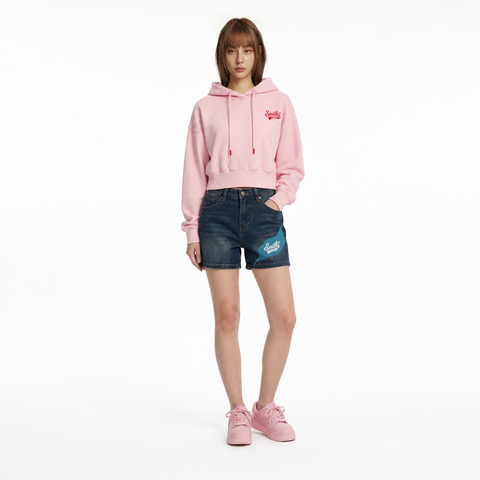 A female model is wearing a hoodie paired with the Smith's 1906 WSO01 Blue Denim Shorts.