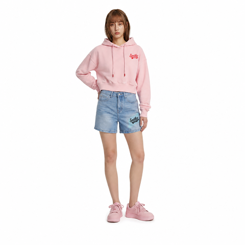 A female model is wearing a hoodie paired with the Smith's 1906 WSO01 Light Blue Denim Shorts.