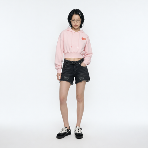 A female model is wearing a hoodie paired with the Smith's 1906 WSO02 Dark Grey Denim Shorts.