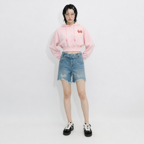 A female model is wearing a hoodie paired with the Smith's 1906 WSO02 Light Blue Denim Shorts.