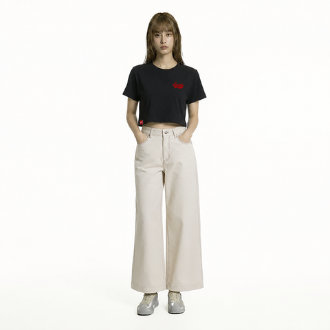 A female model is wearing a pair of pants paired with the Smith's 1906 WTE01 Black T-shirt.