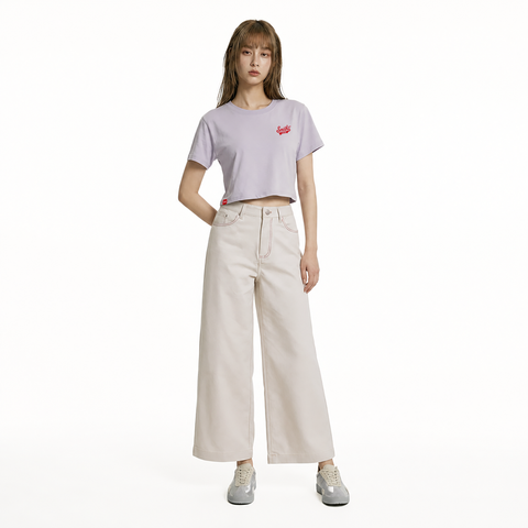 A female model is wearing a pair of pants paired with the Smith's 1906 WTE01 Lilac T-shirt.