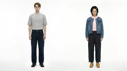 One male model and one female model wearing Smith's 1906 clothing are standing.